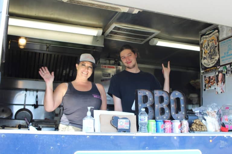 Two Three Little Piggies BBQ staff members in food truck