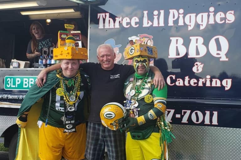 Three Little Piggies Staff and Green Bay Packers fans outside truck